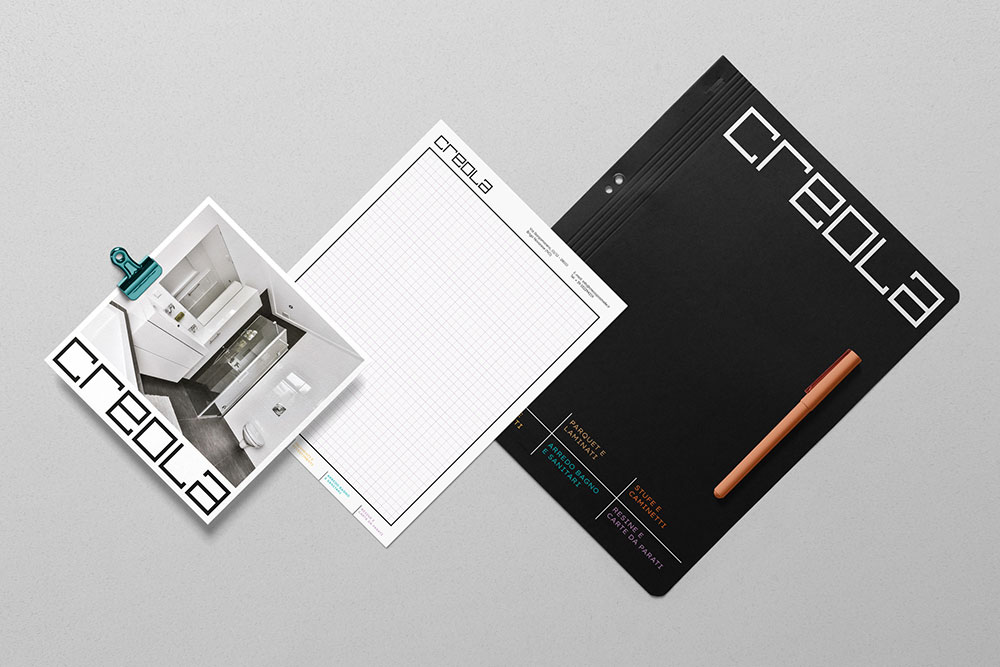 brochure, block notes e cartellina con logo e brand identity di Creola Piastrelle
